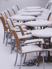 snowy chairs tables winter