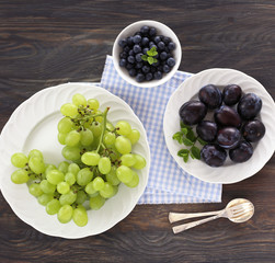 Plums, green grapes and blueberries