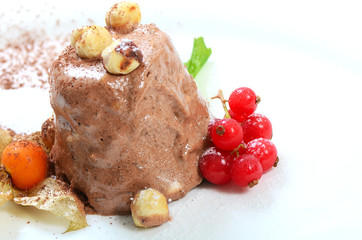 Fototapeta na wymiar Ice-cream with chocolate and wood nuts