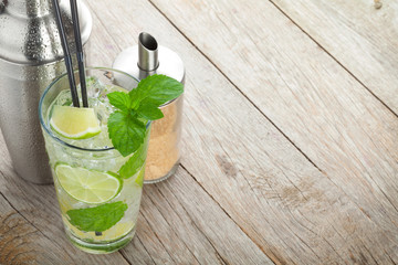 Fresh mojito cocktail and bar utensils