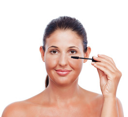 Beauty treatment woman applying Mascara - isolated on white