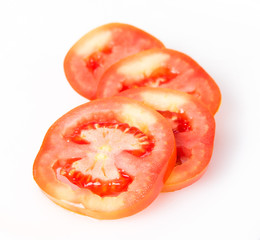 Fresh tomatoes with water drops on white background