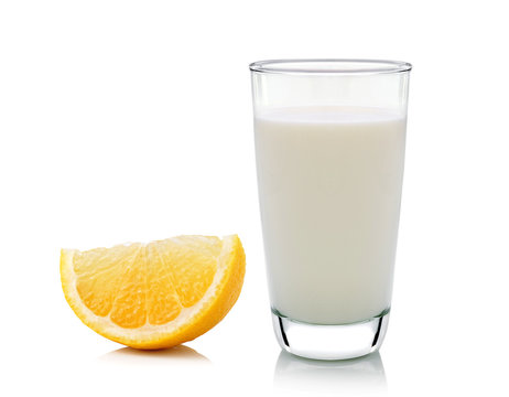 Glass of milk and Half lemon fruit on white background, fresh an
