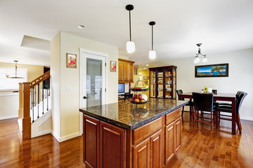 Kitchen island with granite top in bright room