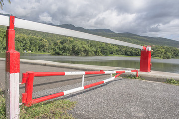 red Barrier Gate with mountain and lake  background