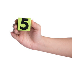Hand holind colorful plastic numbers on a white background