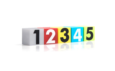 Colorful plastic numbers on a white background