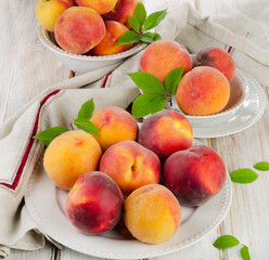 fresh peaches on a wooden table