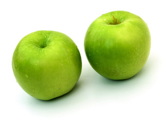 Green apples on a white background