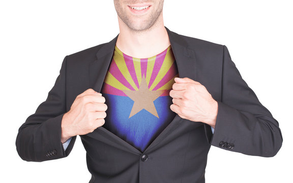 Businessman opening suit to reveal shirt with state flag