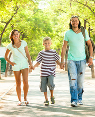 Obraz premium Happy family of three with teenager