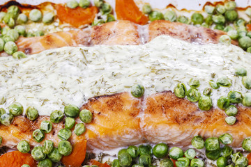 Roasted salmon with dill sauce and green peas