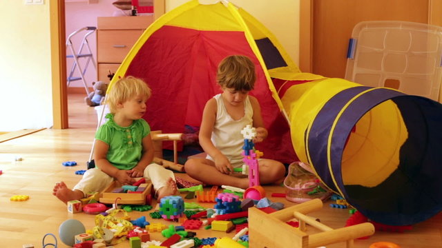 children playing with  toys in home interior