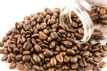 Roasted coffee beans and glass bottle