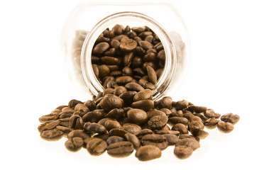 Roasted coffee beans and glass bottle