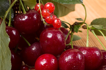 ripe cherry on a wooden table, food close up 