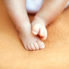 A close-up of tiny baby feet