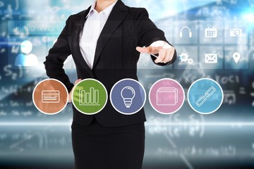Businesswoman in suit pointing finger to business app buttons
