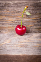 Cherries on wooden table macro background 