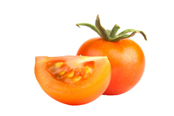 a yellow tomato and slice isolated on white background
