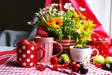 Still life with berries and flowers