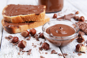 Sweet chocolate cream in bowl on table close-up