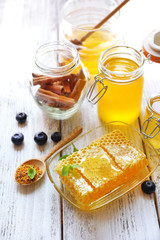 Fresh honey on wooden table