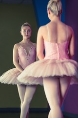 Graceful ballerina standing in first position in front of mirror © WavebreakmediaMicro