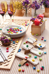 Buffet table with dishware waiting for guests