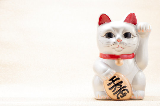 Japanese beckoning cat also known as maneki neko