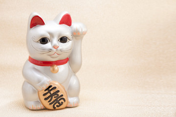 Japanese beckoning cat also known as maneki neko