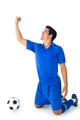 Foto op Plexiglas Happy football player in blue celebrating © WavebreakmediaMicro