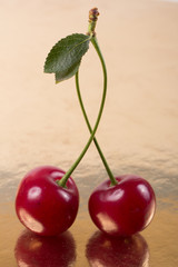 Cherries on gold background