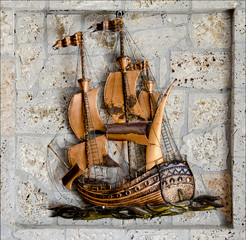handmade bronze ship and stones