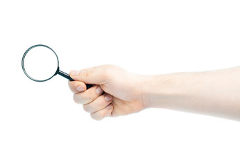 Caucasian male hand holding magnifying glass