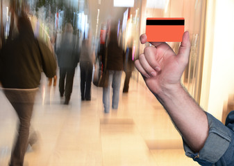 Man holding a credit card in his hand