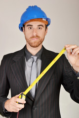 Architect measuring with a meter