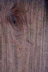 Old wooden surface with gnarl in brown tone