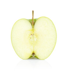 Studio shot of green apple cut in half isolated