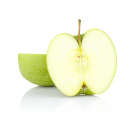 Studio shot of green apple cut in half isolated