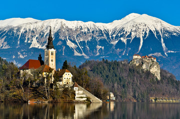 St. Martin Church on Island in Lake Bled with Mountains