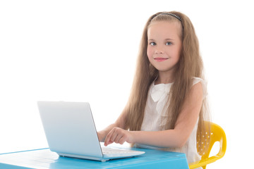 beautiful little girl using laptop isolated on white