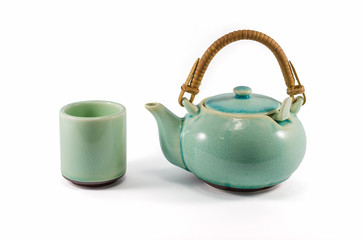 Chinese green teapot and teacup isolated