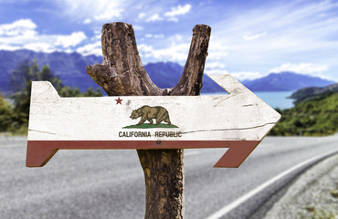 California State wooden sign with a paradise on background