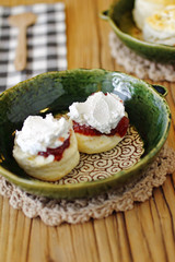 close up japanese scones and fruit jam in ceramic dish