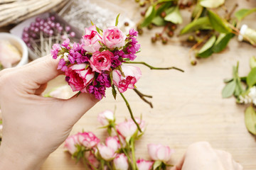 Steps of making wrist corsage. Florist at work.