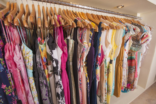 Womens clothes hanging on rail