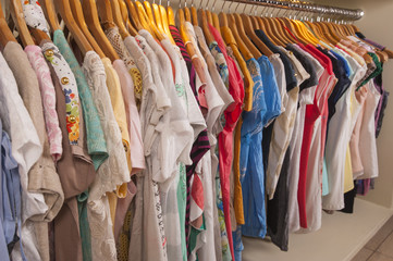 Womens clothes hanging on rail
