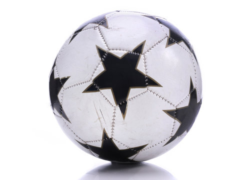 Old soccer ball on white