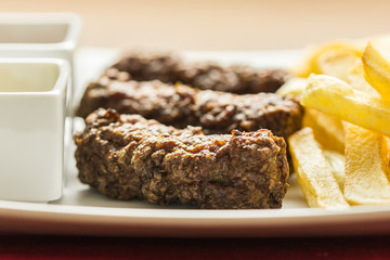 Traditional Romanian Mici And French Fries